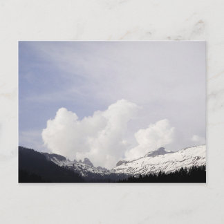 Big white clouds over the mountains postcard
