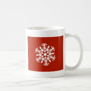 Big white snowflake on red coffee mug