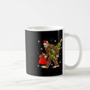 Bigfoot Carrying Christmas Tree Sasquatch Believer Coffee Mug