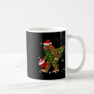 Bigfoot Carrying Christmas Tree Sasquatch Believer Coffee Mug