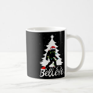 Bigfoot Carrying Christmas Tree Sasquatch Believer Coffee Mug