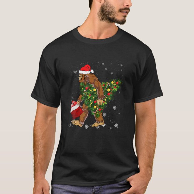 Bigfoot Carrying Christmas Tree Sasquatch Believer T-Shirt (Front)