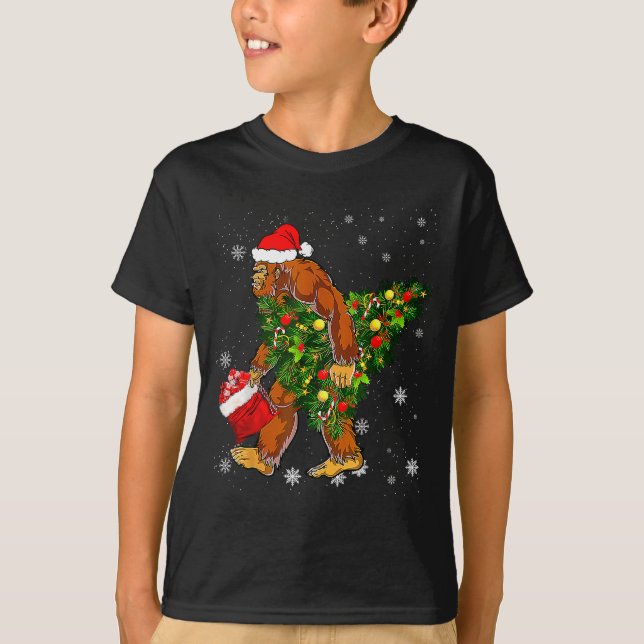 Bigfoot Carrying Christmas Tree Sasquatch Believer T-Shirt (Front)