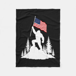 Bigfoot holding american flag silhouette design fleece blanket