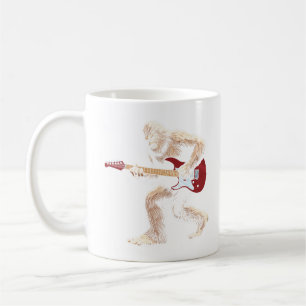 Bigfoot playing electric guitar guitarist left coffee mug