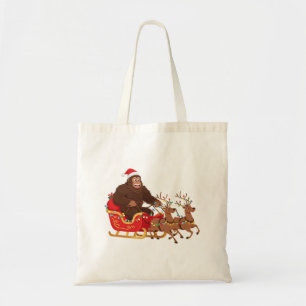 Bigfoot Riding a Christmas Sleigh Through the Snow Tote Bag