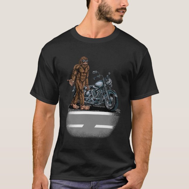 Bigfoot Riding A Motorcycle Bike Trying To Hitch A T-Shirt (Front)