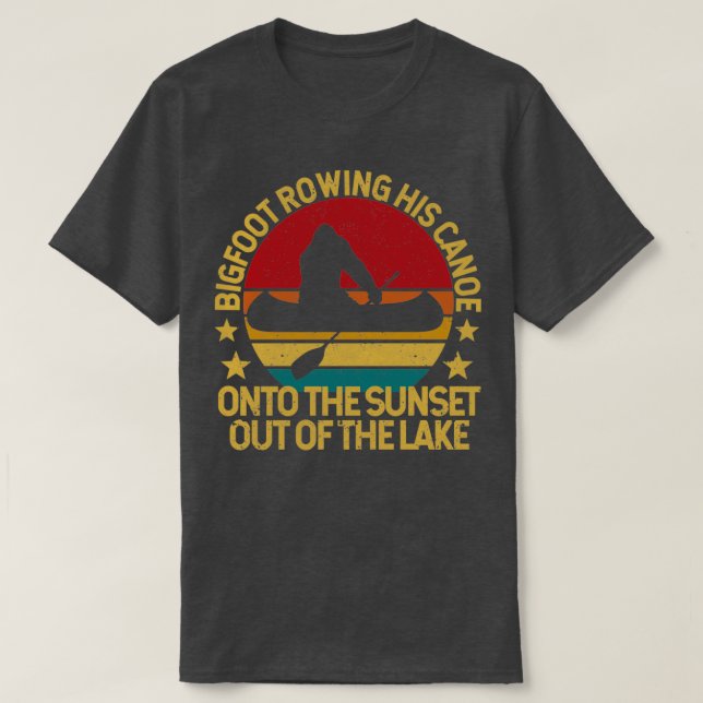 Bigfoot rowing his canoe into the sunset T-Shirt (Design Front)