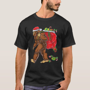 Bigfoot Santa Carrying Christmas Bag Xmas Hat Sasq T-Shirt