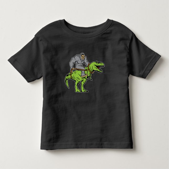Bigfoot Sasquatch Riding Dinosaur T rex Toddler T-Shirt (Front)