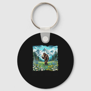 Bigfoot walks in flower field forest sasquatch key ring