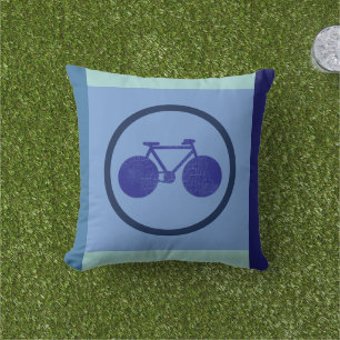Bike-inspired design of bicycle on geometric blue cushion