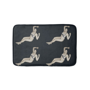 bikini model on black bath mat