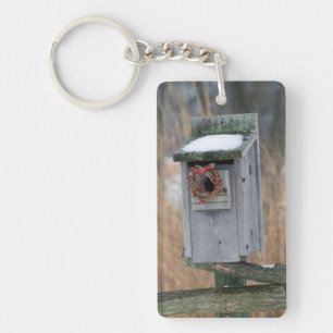 Bird, nest box with holiday wreath in winter key ring