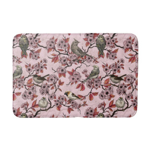 Birds and cherry blossom on rose pink bath mat