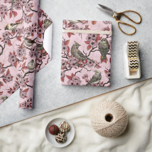 Birds and cherry blossom on rose pink wrapping paper