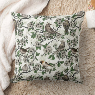 Birds and cherry blossom on white cushion