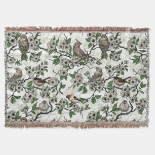 Birds and cherry blossom on white throw blanket