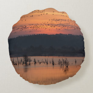 Birds at sunrise round cushion