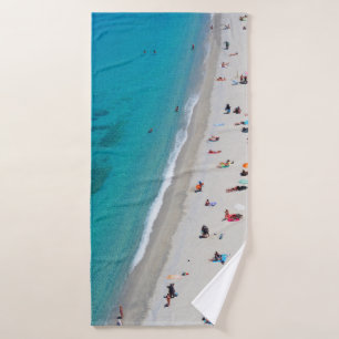 Bird's eye view photo of people on beach bath towel