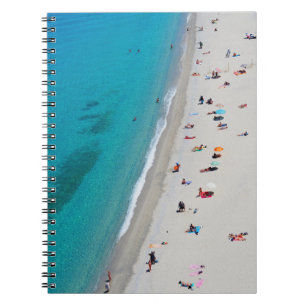 Bird's eye view photo of people on beach notebook