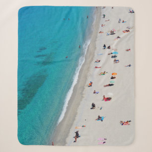 Bird's eye view photo of people on beach sherpa blanket
