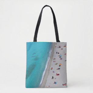 Bird's eye view photo of people on beach tote bag