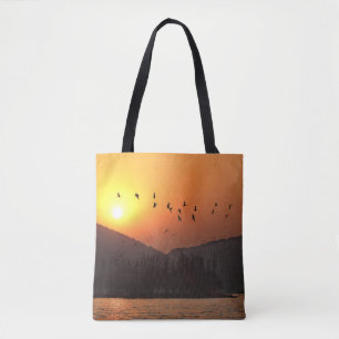 Birds Flying in Sunset Sky Over East Lake Tote Bag