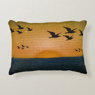 Birds flying over sunset seascape decorative cushion