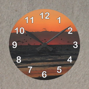 Birds Flying Over the Ocean Sunrise Photo Round Clock