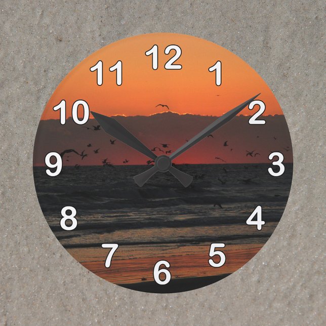 Birds Flying Over the Ocean Sunrise Photo Round Clock (A clock with a photo of birds flying over the ocean during sunrise.)