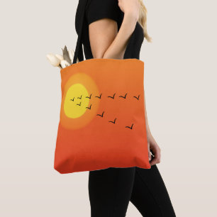 Birds flying to the sun tote bag