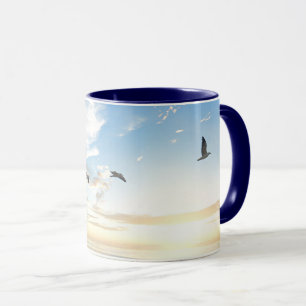 Birds in flight over the ocean mug