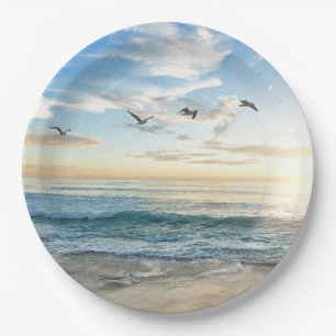 Birds in flight over the ocean paper plate