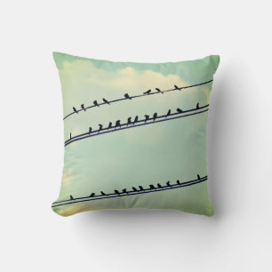 Birds on wires, vintage blue sky. cushion