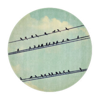 Birds on wires, vintage blue sky. cutting board