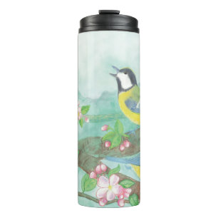 Birds singing on a blossoming tree branch thermal tumbler