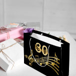 Birthday black gold music notes monogram large gift bag<br><div class="desc">Black background with faux gold music notes for a 30th birthday. Templates for the age 30 and name.  The name is written in a hand-lettered style script.  Golden letters and number.</div>