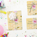 Birthday happy bumble bees honeycomb florals wrapping paper sheet<br><div class="desc">A golden,  yellow background with a bee honeycomb pattern and happy smiling bumble bees. Decorated with pink tropical Hibiscus florals,  flowers.  Green hand lettered script and the text: Happy Birthday</div>