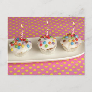 Birthday muffins with icing, sprinkles and postcard