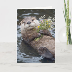 Birthday Otter Floating with Wildflower Bouquet Card