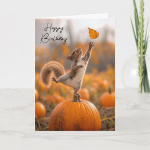 Birthday Squirrel Balancing on an Orange Pumpkin Card