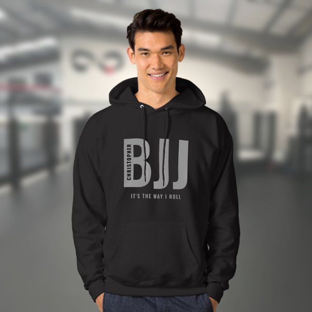 BJJ Brazilian Jiu Jitsu Edit Name & Text Casual Hoodie (Personalized black BJJ hoodie worn by a male model in a gym)