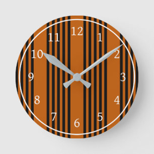 Black and burnt orange five stripe pattern round clock