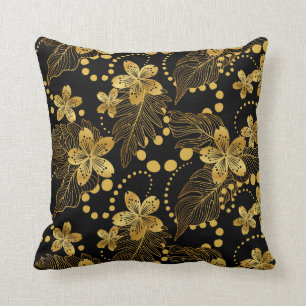 Black and gold tropical flowers and leaves pattern cushion