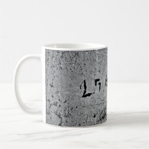 Black and grey concrete surface coffee mug