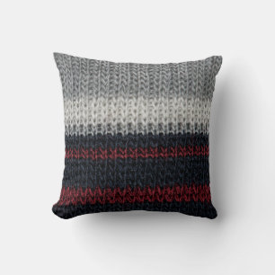 Black and grey knitting wool with red and white st cushion