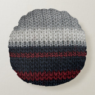 Black and grey knitting wool with red and white st round cushion