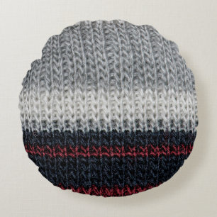 Black and grey knitting wool with red and white st round cushion