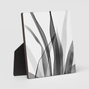 Black and white botanical design plaque